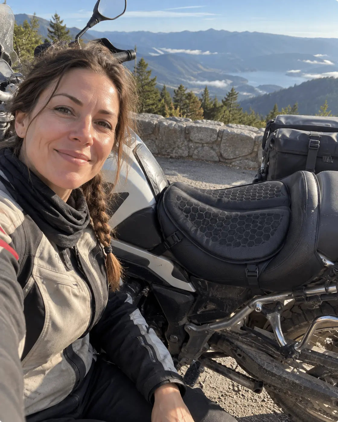 Fictional adventure rider beside a motorcycle fitted with a gel cushion